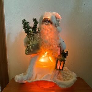 Vintage Trim a Home Santa with color changing fiber optic lighting.